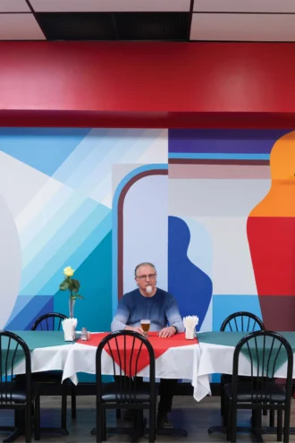 Owner Michael Uspenski sits in Restaurant Volga.