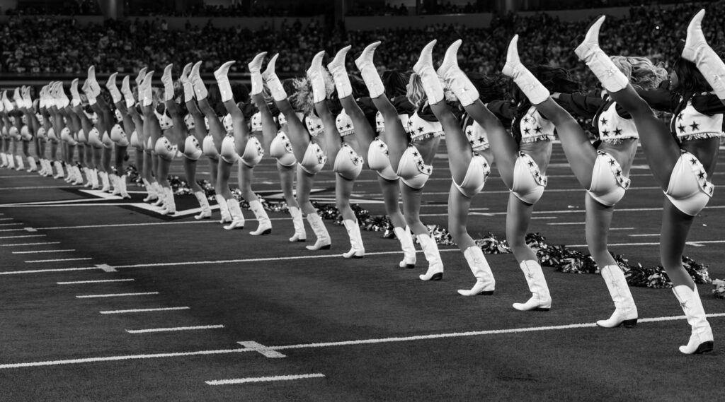 The DCC’s signature kickline in black and white.