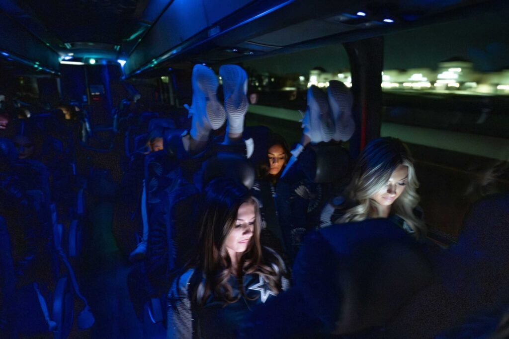 The squad unwinds on the late-night bus ride.